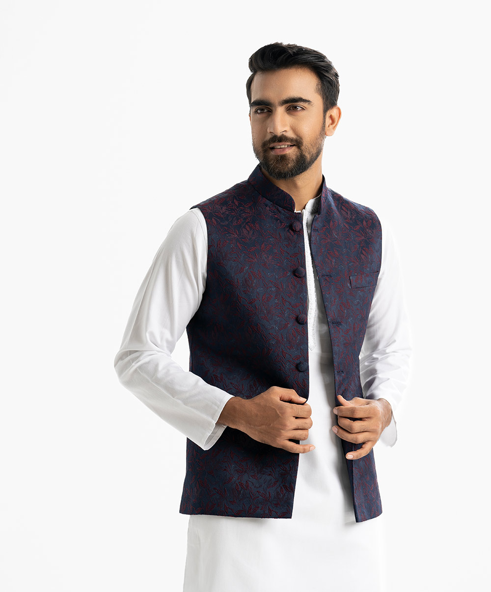 Men's Waistcoat in Jacquard fabric. Mandarin collar, sleeveless, straight hem with button closure and three pockets at front. Men's Waistcoat in Jacquard fabric. Mandarin collar, sleeveless, straight hem with button closure and three pockets at front.