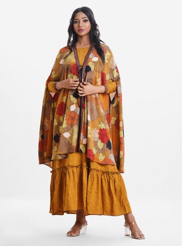Women's gown style abaya upper part in printed georgette fabric with patchwork front opening in tassel ties. And flared gown in viscose fabric with three-quarter sleeves.