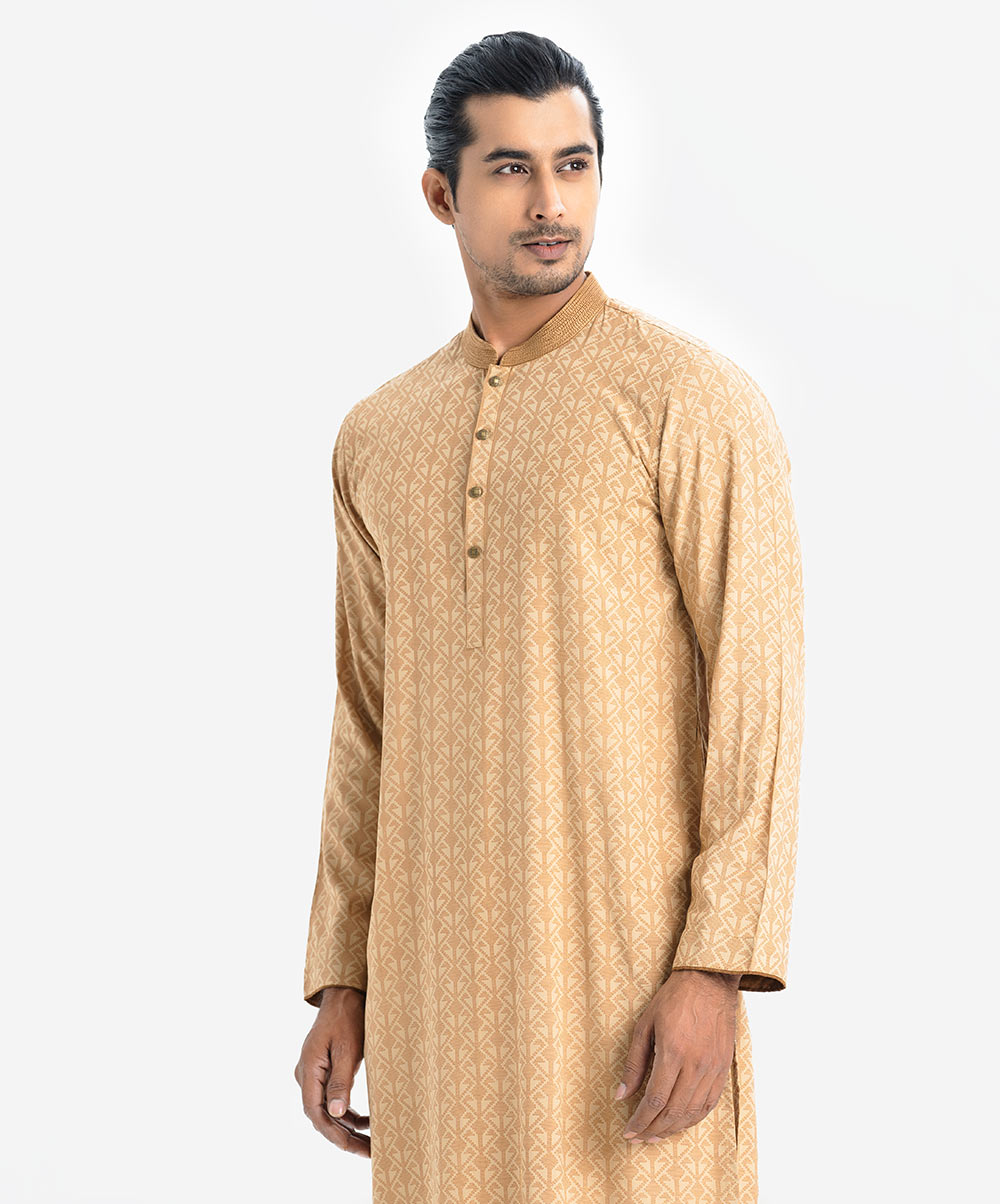 Men's semi fitted panjabi in viscose fabric. Mandarin collar with line stitching, and inseam pockets. Men's semi fitted panjabi in viscose fabric. Mandarin collar with line stitching, and inseam pockets.