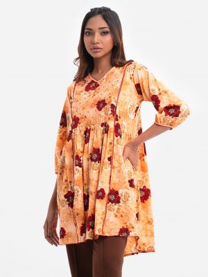 V-neck patterned tunic in georgette fabric. Puff sleeves, sequined at the front.