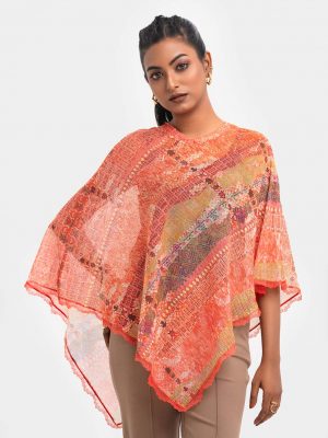 Jacquard woven poncho with lace details.